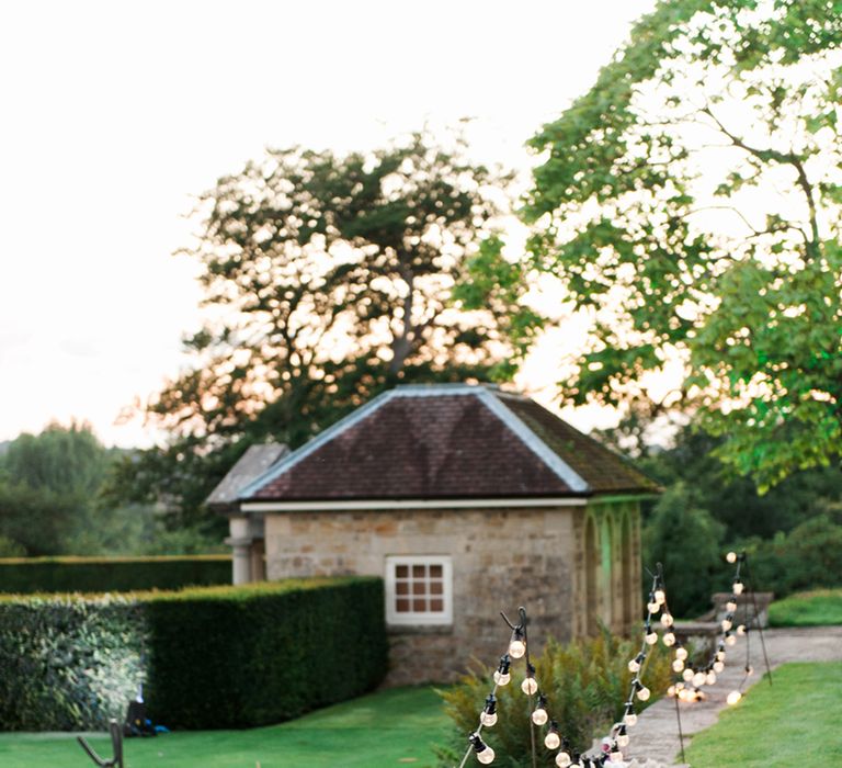 Fairy Lights | Cowdray House, West Sussex | Photography by Emma Pilkington | Beattie Bailey planning &amp; Styling | Bride wears Suzanne Neville