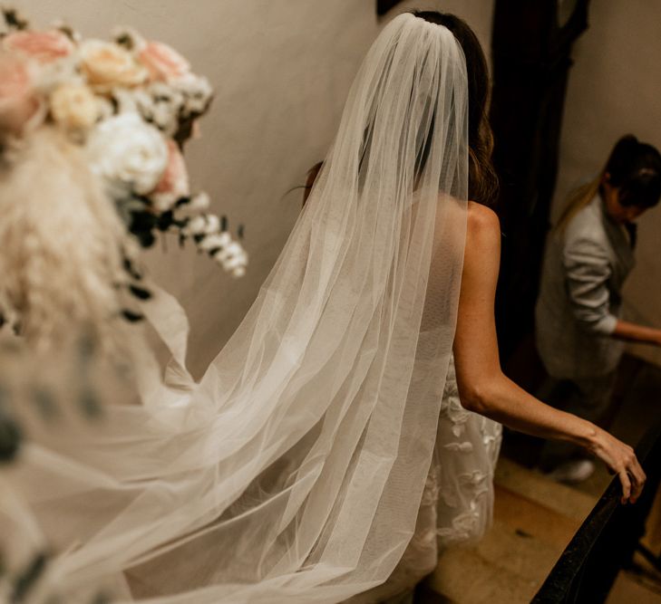 Bridal Entrance in Emma Beaumont Wedding Dress and Cathedral Length Wedding Veil