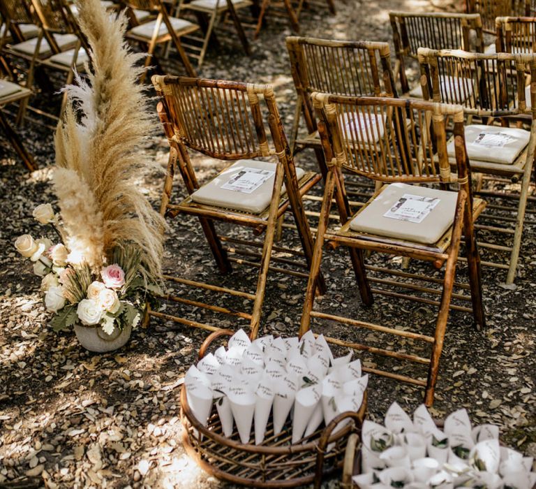 Outdoor Wedding Ceremony Decor with Bamboo Chairs, Pampas Grass Floral Arrangements and Personalised Confetti Cones