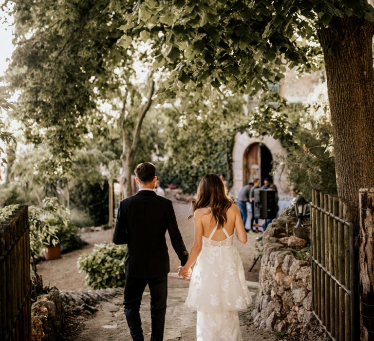 Bride in Emma Beaumont Wedding Dress and Groom in Givenchy Tuxedo