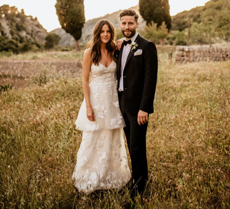 Bride in Emma Beaumont Wedding Dress and Groom in Givenchy Tuxedo