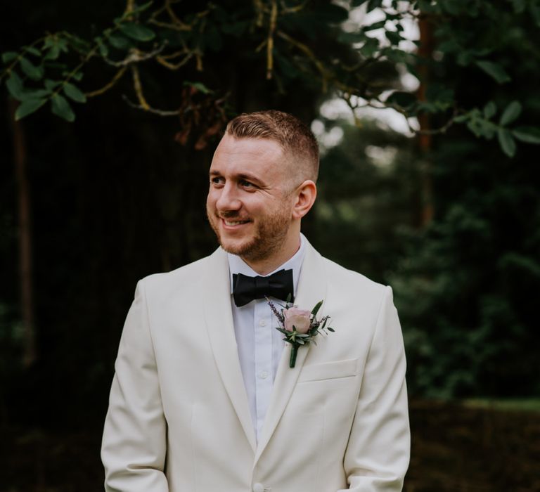 Groom in White Dinner Jacket and Bow Tie