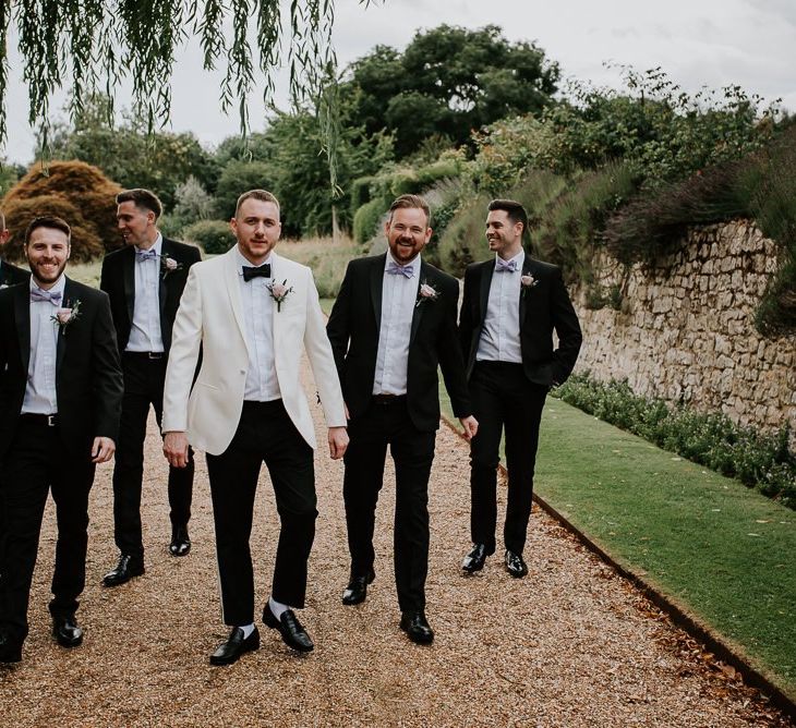 Groomsmen in Tuxedos with Groom in White Dinner Jacket