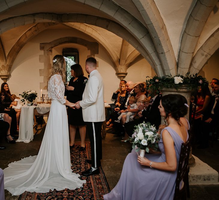 Wedding Ceremony with Bride in Separates and Groom in White Dinner Jacket