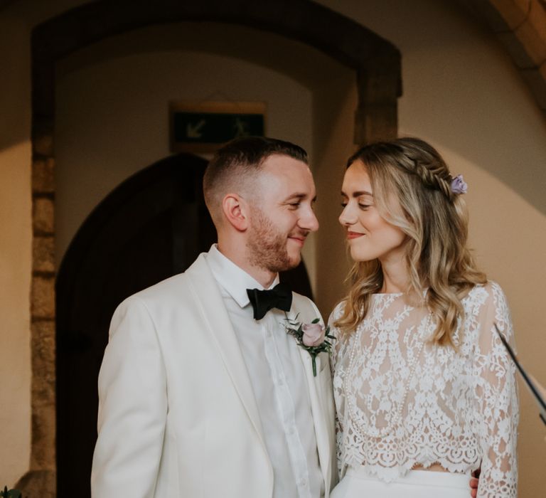 Bride in Lace Top and Plain Skirt Separates with Groom in White Dinner Jacket and Bow Tie