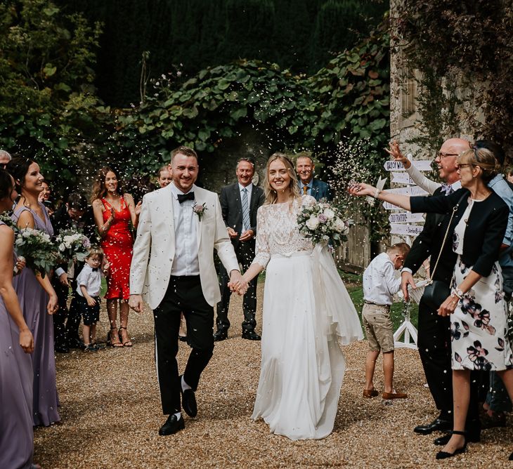 Confetti Moment with Bride in Separates and Groom in White Dinner Jacket