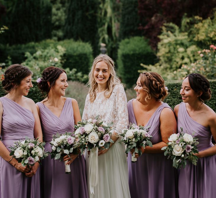 Bridal Party with Bridesmaid in Purple Dresses and Hair Braids