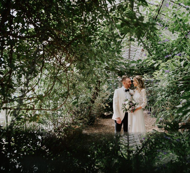 Bride in Wendy Makin Bridal Separates and Groom in White Dinner Jacket