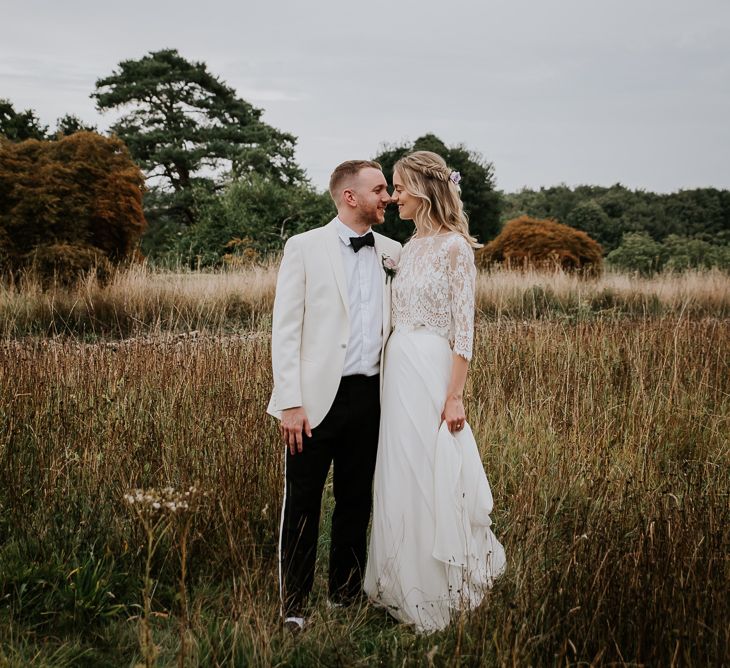 Bride in Lace Top and Plain Skirt by Wendy Makin  with Groom in White Dinner Jacket and Bow Tie