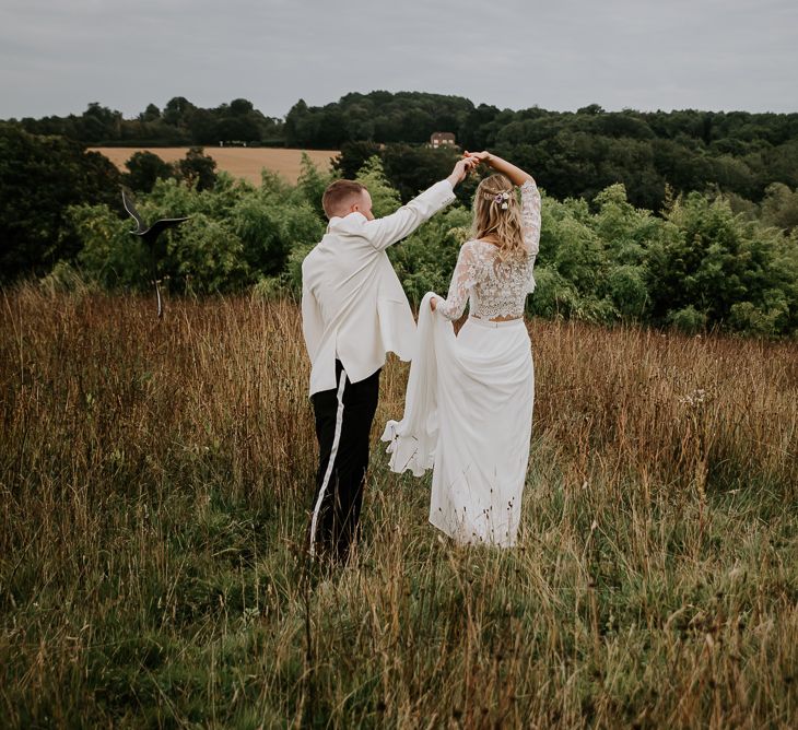 Groom in White Dinner Jacket  Twirling His Bride in a Wendy Makin  Bridal Separates