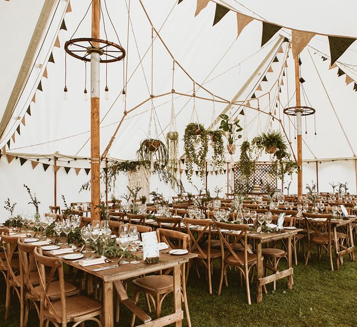 Tipi Interior with Bunting and Hanging Pot Plants