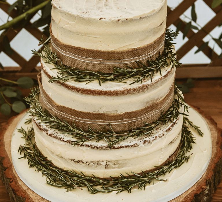 Three-Tier Wedding Cake on Log Slice Stand