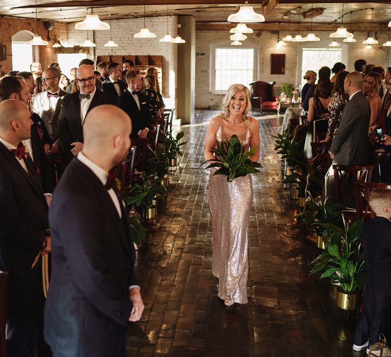 Bridesmaid in Gold Sequin Dress Walking Down The Aisle