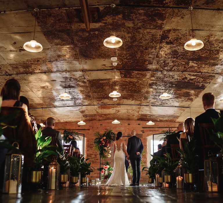 Bride and Groom Standing at The Altar in The West Mill Wedding Venue