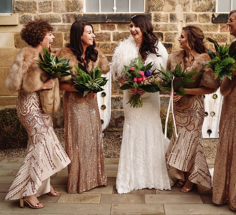 Bridal Party with Bridesmaids in Gold Sequin Dresses and Faux Fur Cover Ups  and Bride in Martina Liana Wedding Dress &amp; Ostrich Feather Cover-up