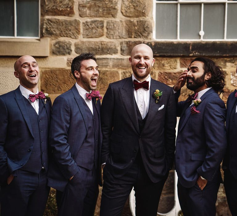 Groom in Tom Ford Suit and Bow Tie and Groomsmen in Navy Suits