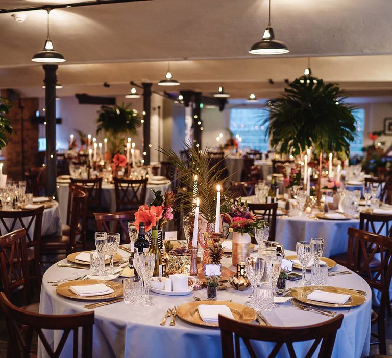 Tropical Wedding Reception Table Decor with Gold Platters and Foliage Centrepieces