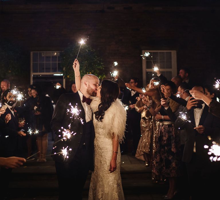 Sparkler Moment with Bride in Martina Liana Wedding Dress &amp; Ostrich Feather Cover-up and Groom in Tom Ford Suit