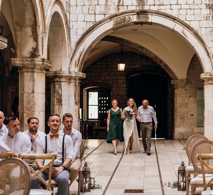 Bride walks down the aisle at Croatian wedding