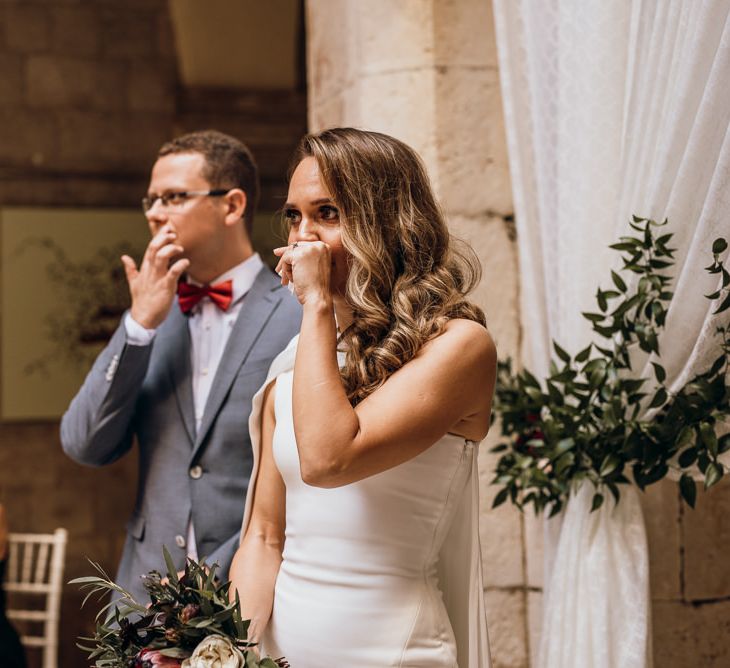 Bride sees her future wife for first time in high low wedding dress at ceremony