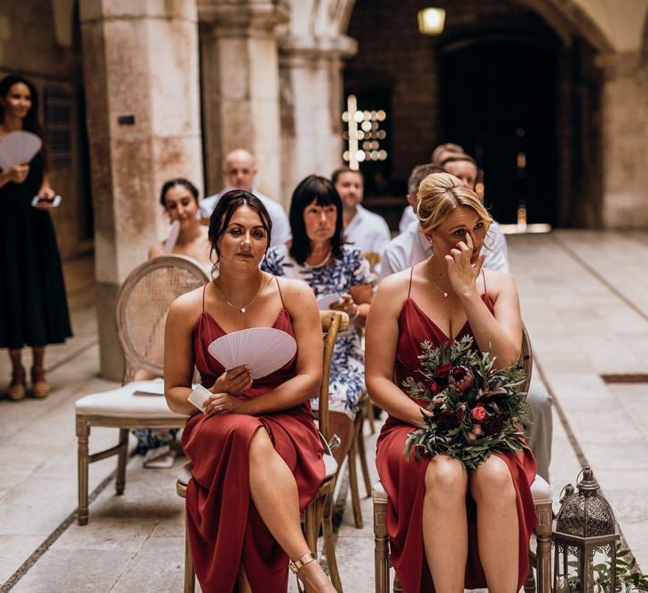 Bridesmaids watch on as same-sex couple get married