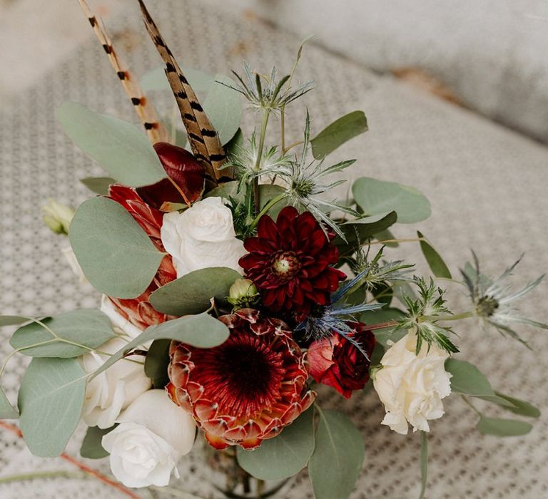 King protea wedding bouquet with red and white flowers