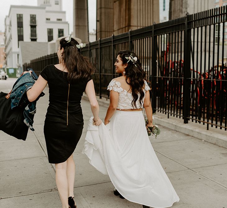 Bride walking to a first look with her groom wearing bridal separates for a New York City wedding