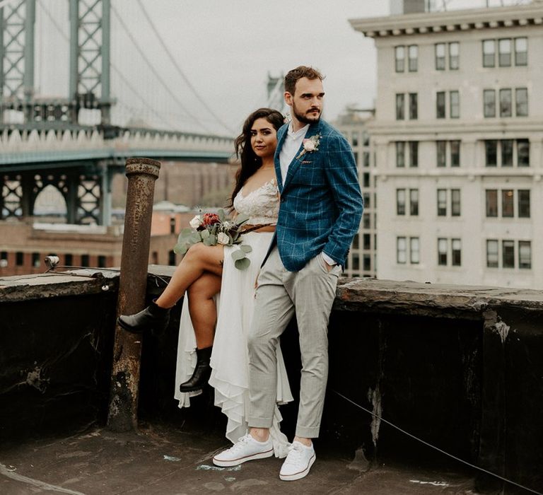 Bride and Groom first look moment on rooftop building with Manhattan skyline and bridal separates