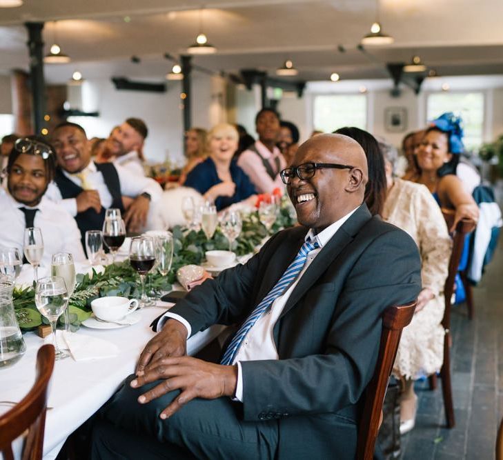 Guests enjoy the wedding speeches