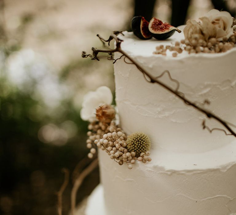 Buttercream Wedding Cake Decorated with Twine and Woodland Flowers