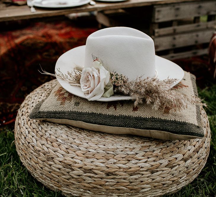 Wicker Pouf, Moroccan Cushion and Flower Covered Fedora Hat