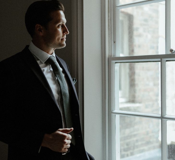 Wedding Morning Preparations | Groom in Marks &amp; Spencer Suit with Olive Tie | Beaded Needle &amp; Thread Dress for Intimate Islington Wedding | Olivia &amp; Dan Photography