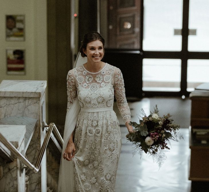 Arrival of the Bride | Beaded Needle &amp; Thread Wedding Dress with Long Sleeves | Britten Veil | Maroon and White Bridal Bouquet with Green Foliage | Islington Town Hall | Beaded Needle &amp; Thread Dress for Intimate Islington Wedding | Olivia &amp; Dan Photography