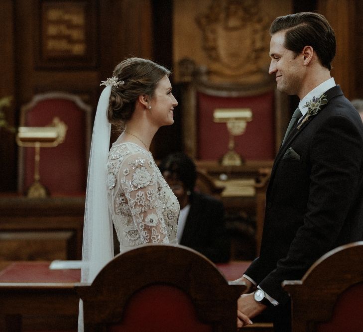 Wedding Ceremony | Bride in Beaded Needle &amp; Thread Wedding Dress with Long Sleeves | Groom in Marks &amp; Spencer Suit with Olive Tie | Britten Veil | Tania Maris Hairpiece | Islington Town Hall | Beaded Needle &amp; Thread Dress for Intimate Islington Wedding | Olivia &amp; Dan Photography