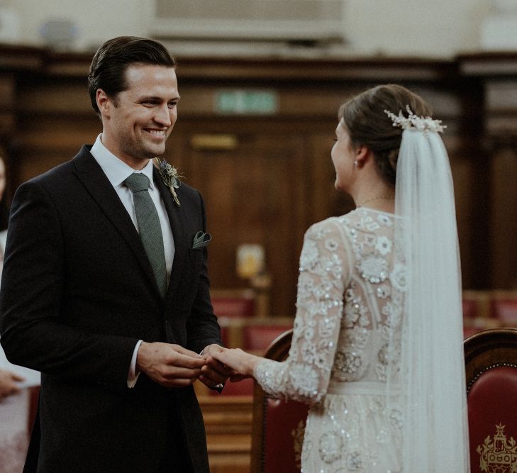 Wedding Ceremony | Bride in Beaded Needle &amp; Thread Wedding Dress with Long Sleeves | Groom in Marks &amp; Spencer Suit with Olive Tie | Britten Veil | Tania Maris Hairpiece | Islington Town Hall | Beaded Needle &amp; Thread Dress for Intimate Islington Wedding | Olivia &amp; Dan Photography