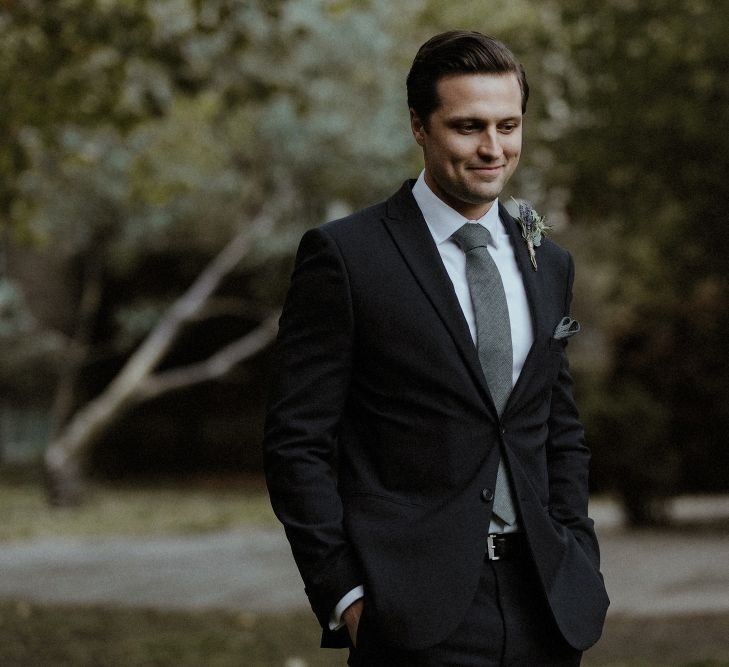 Groom in Marks &amp; Spencer Suit with Olive Tie | Beaded Needle &amp; Thread Dress for Intimate Islington Wedding | Olivia &amp; Dan Photography