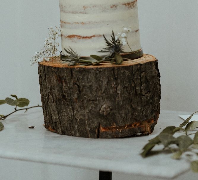 Semi Naked Wedding Cake Displayed on Log | Bourne &amp; Hollingsworth Buildings | Beaded Needle &amp; Thread Dress for Intimate Islington Wedding | Olivia &amp; Dan Photography