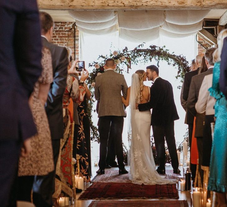 Norfolk wedding with supermarket wedding cake and floral moon gate