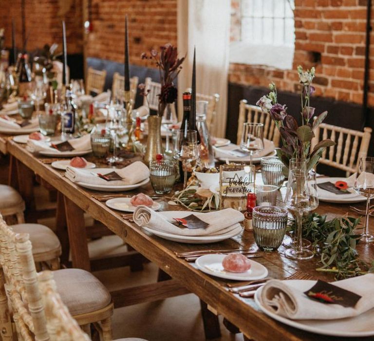 Wedding breakfast table decor with flowers and rustic elements