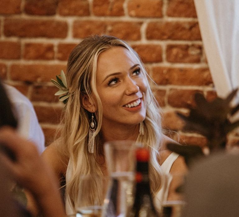 Bride enjoys wedding speeches