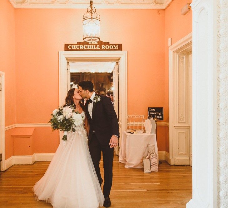 Bride and groom embrace at London wedding