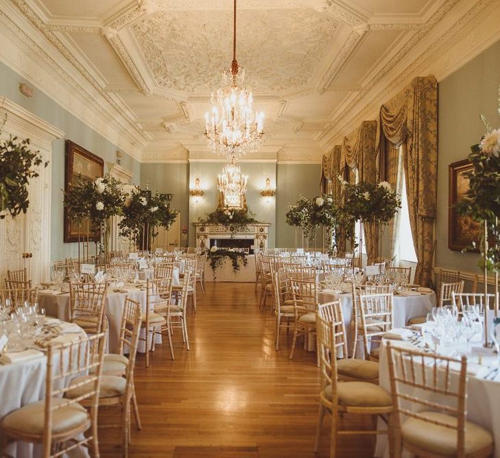 Summer London wedding at Dartmouth House with tall white floral centrepieces