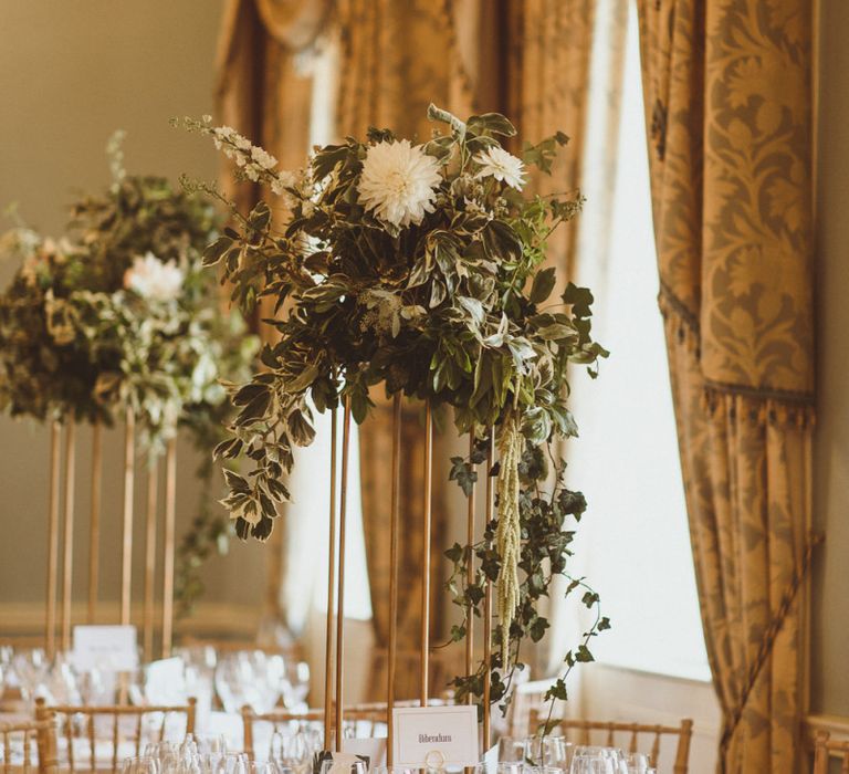 White flower and foliage table arrangements  at London celebration with botanical and art deco styling