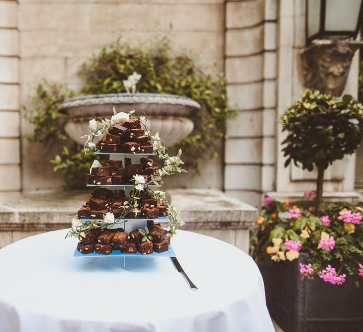 Homemade brownie tier wedding cake at summer reception in London