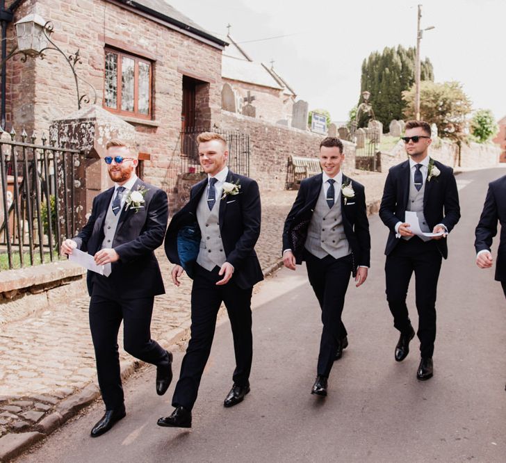 Groomsmen in Navy TM Lewin Three Suits with Grey Waistcoasts