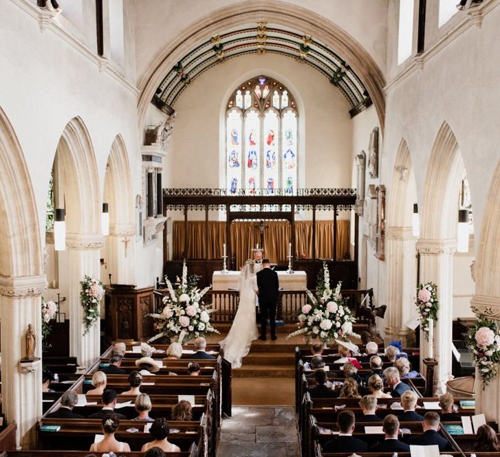 Church Wedding Dress with Bride and Groom at the Altar