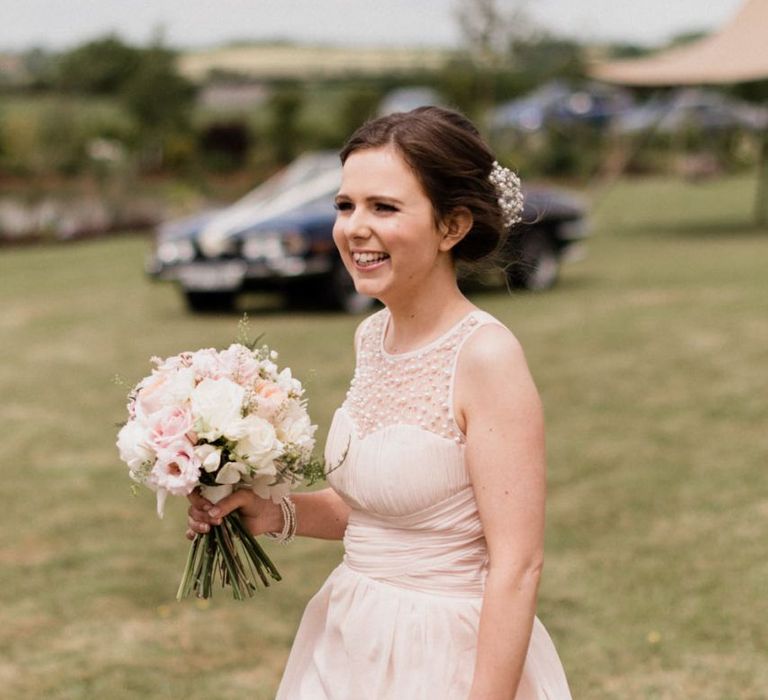 Bridesmaid in Pink Little Mistress Dress Holding a Posey of Pink and White Flowers