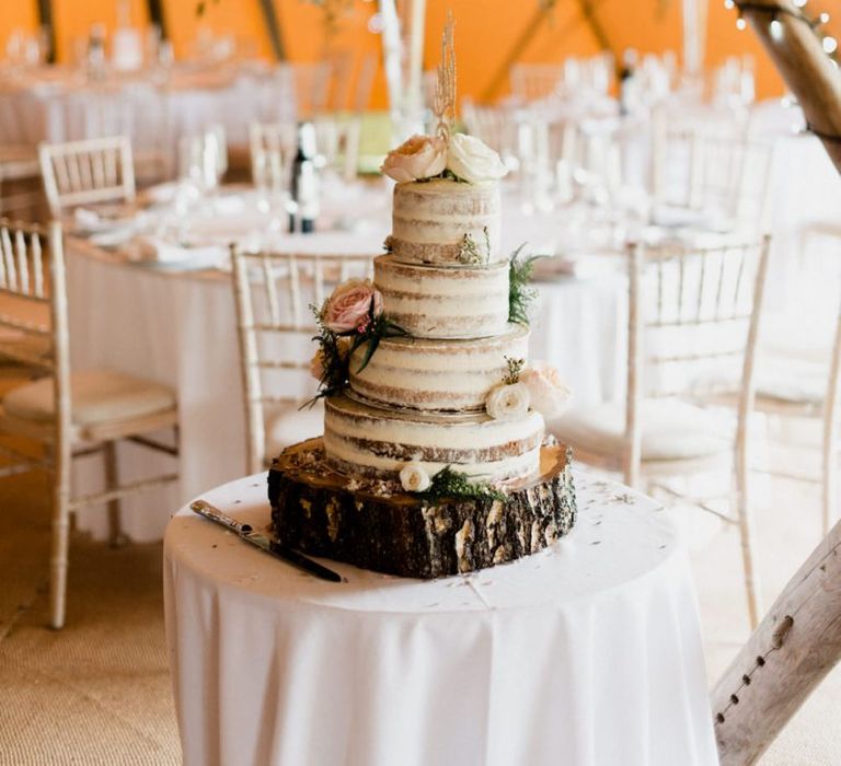 Semi Naked Wedding Cake on Tree Stump Cake Stand  in Tipi Reception