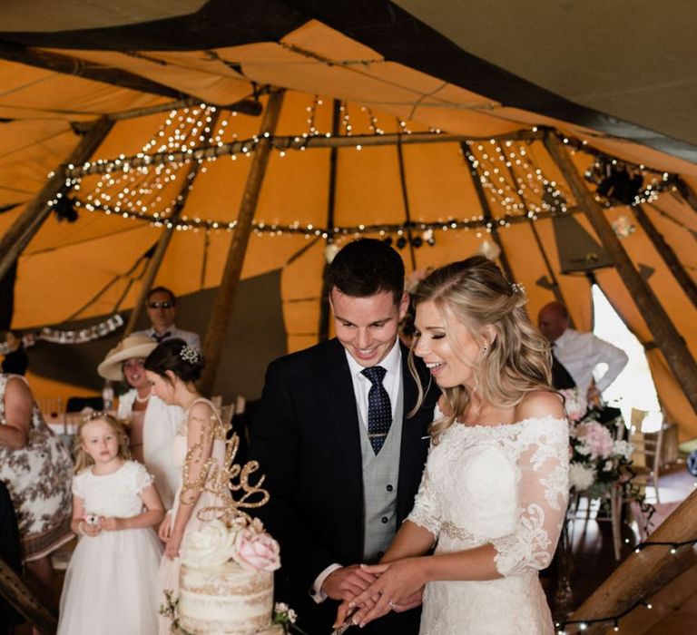 Bride and Groom Cutting the Rustic Wedding Cake