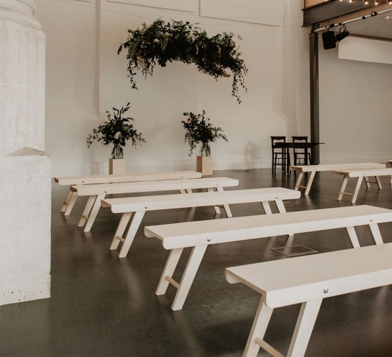 Minimalist Ceremony Room with Fairy Lights, Greenery Installation and Benches